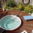 Enjoy a hot tub surrounded by a garden of flowers